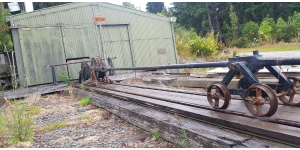 Historic winch system from slipway with shed behind