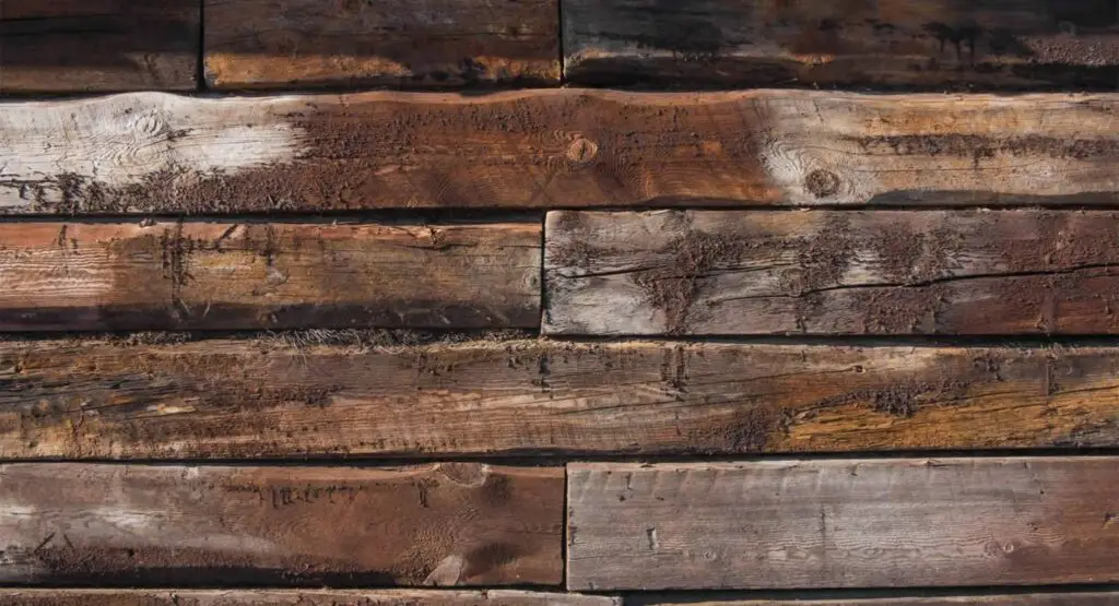 rustic timber stack background 1536x833 1
