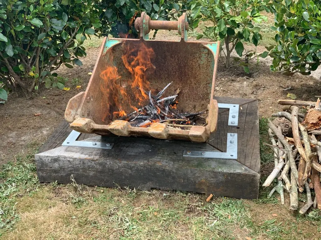 digger bucket used as a fire pit.